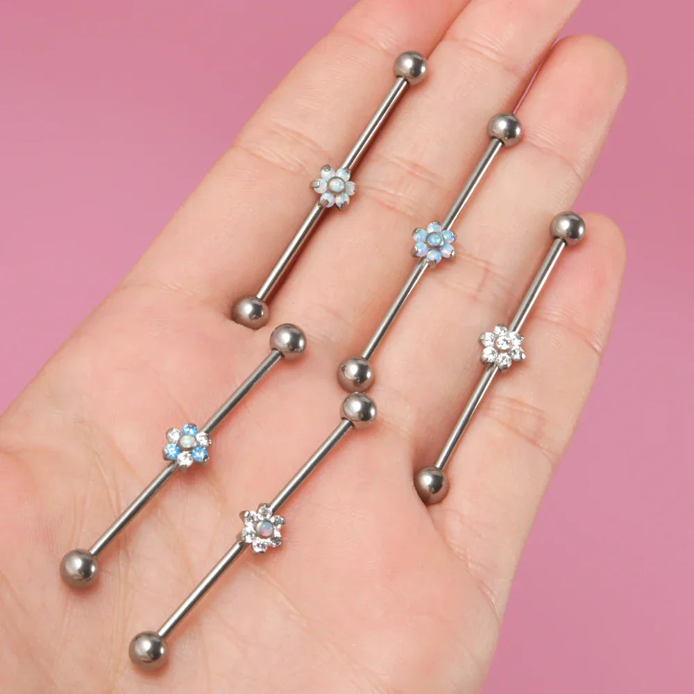 Opal industrial piercing with a flower clear white and blue opal barbell piercing titanium 14G