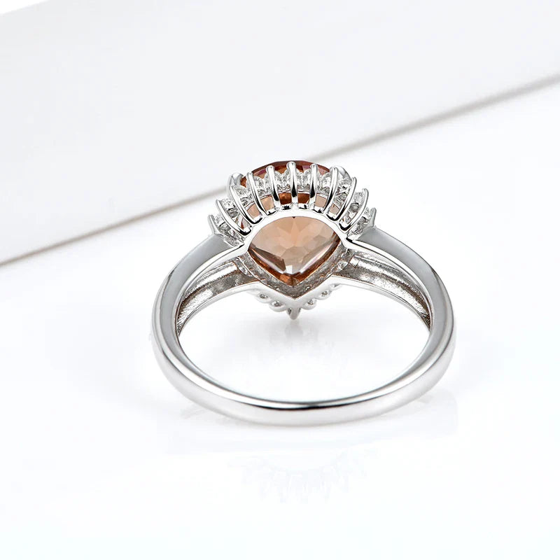 Silver zultanite ring with a pear-shaped zultanite and clear cz stones