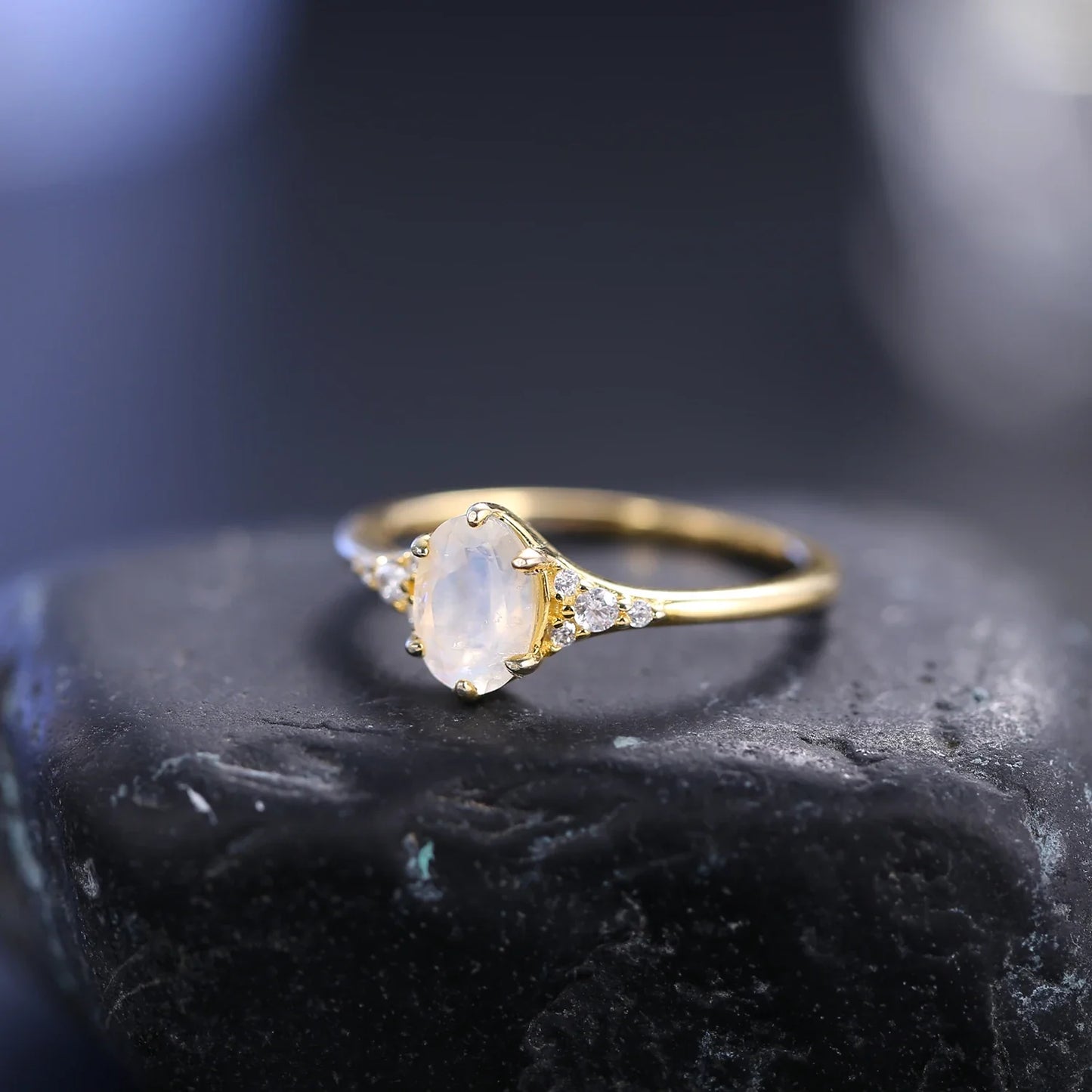 Moonstone and diamond engagement ring with an oval moonstone