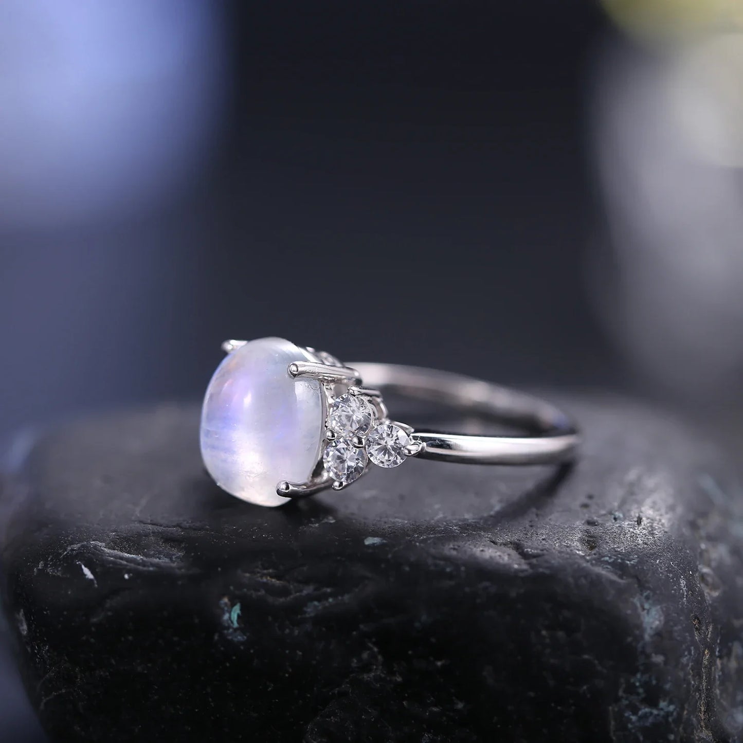 Silver moonstone ring with an oval moonstone and clear diamond cz
