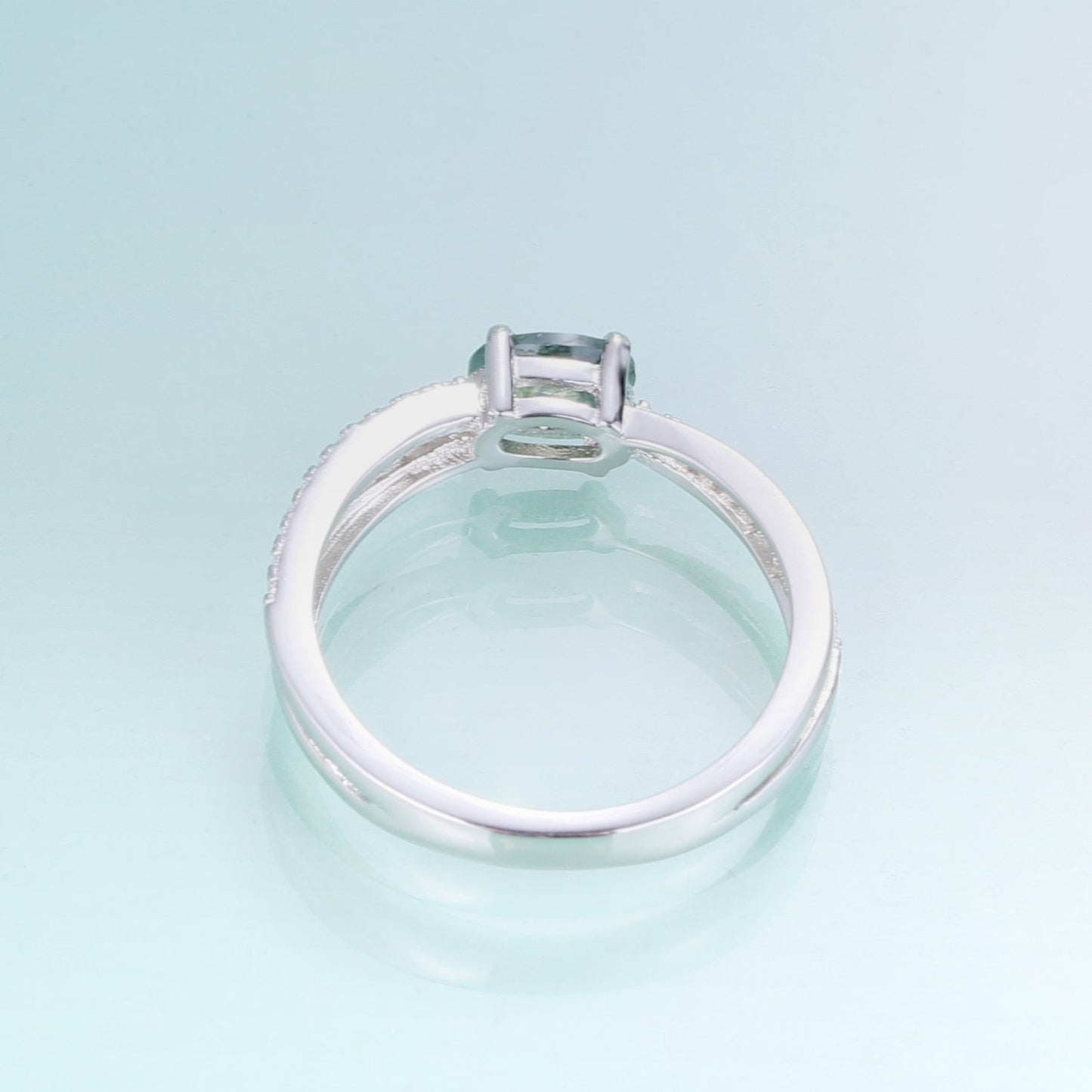 Moss agate wedding ring with a cross-shaped design in silver