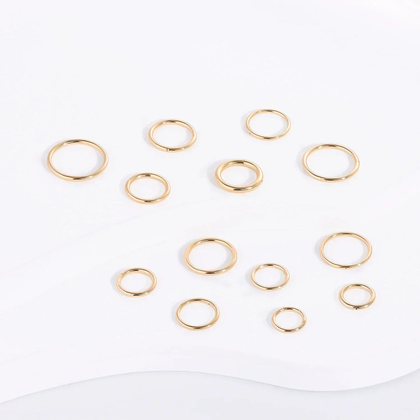 Gold-plated minimalist rings set from Rosary Milano displayed on white background