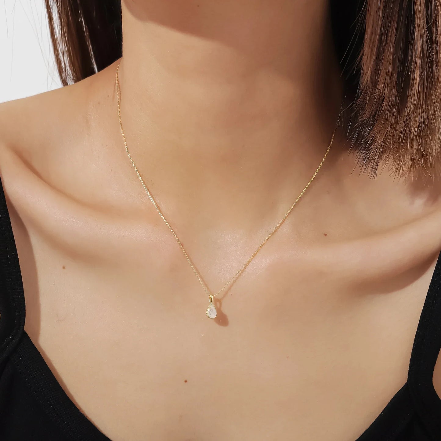 Moonstone crystal necklace in a teardrop shape dainty gold necklace