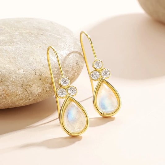 Gold moonstone earrings with teardrop moonstones and three clear diamond cz stones