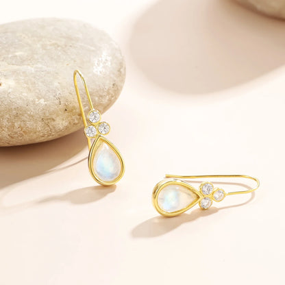 Gold moonstone earrings with teardrop moonstones and three clear diamond cz stones
