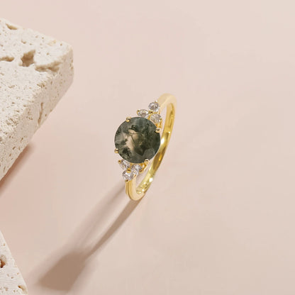Moss agate ring with a round moss agate and three cz on each side gold promise ring