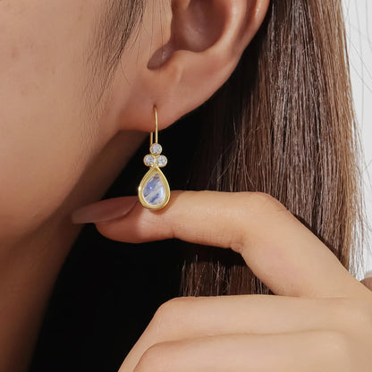 Gold moonstone earrings with teardrop moonstones and three clear diamond cz stones