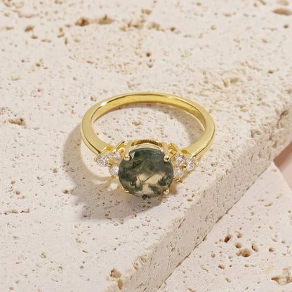 Moss agate ring with a round moss agate and three cz on each side gold promise ring