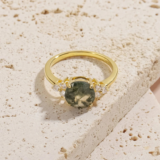 Moss agate ring with a round moss agate and three cz on each side gold promise ring
