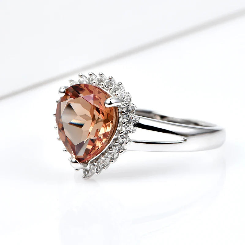 Silver zultanite ring with a pear-shaped zultanite and clear cz stones