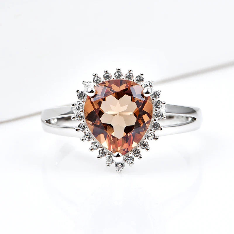 Silver zultanite ring with a pear-shaped zultanite and clear cz stones