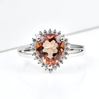 Silver zultanite ring with a pear-shaped zultanite and clear cz stones