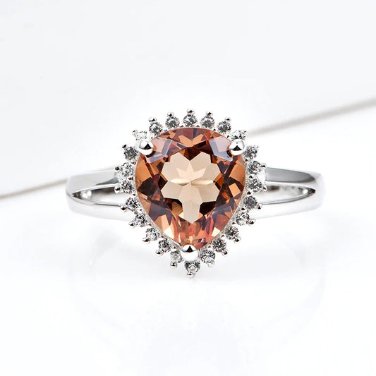 Silver zultanite ring with a pear-shaped zultanite and clear cz stones