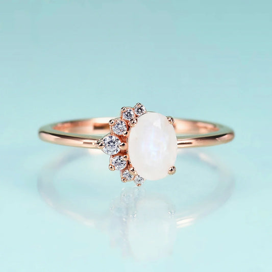 Rose gold moonstone ring with clear cz arranged in a half circle wedding ring for women