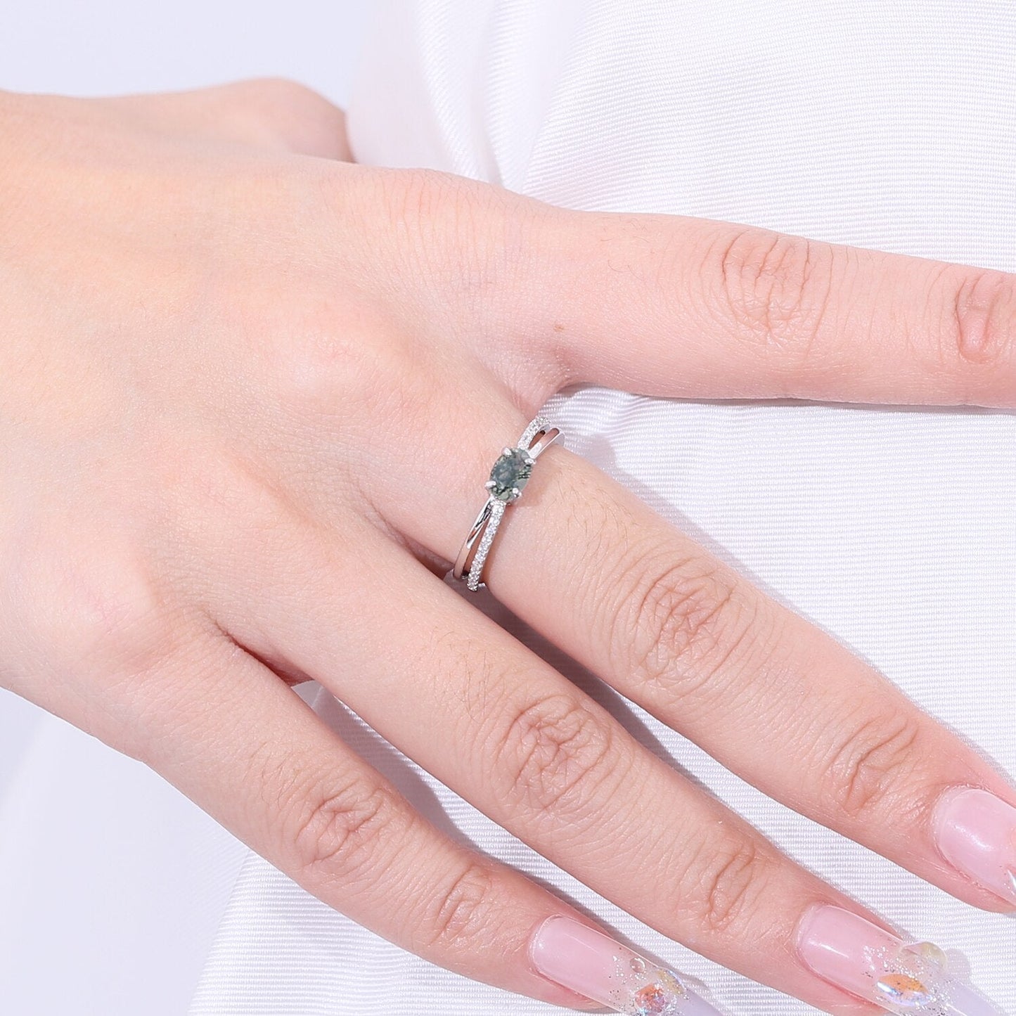 Moss agate wedding ring with a cross-shaped design in silver