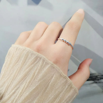 Minimalist silver beaded ring on hand, fashion jewelry from Rosary Milano