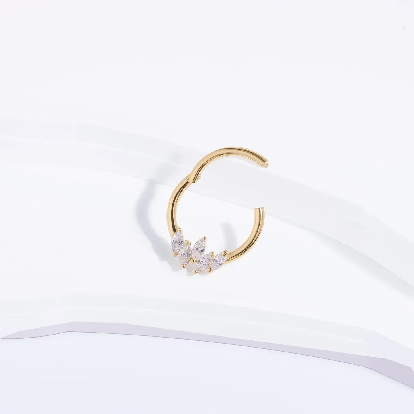 Rosary Milano gold hoop earring with marquise-cut crystals on white background