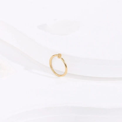 Minimalist gold ring with round accent on white background, Rosary Milano fashion jewelry