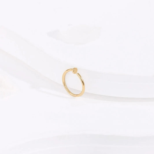 Minimalist gold ring with round accent on white background, Rosary Milano fashion jewelry