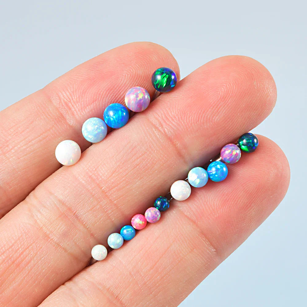 Barbell eyebrow piercing with opal titanium curved barbell