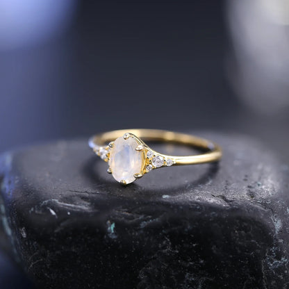 Moonstone and diamond engagement ring with an oval moonstone