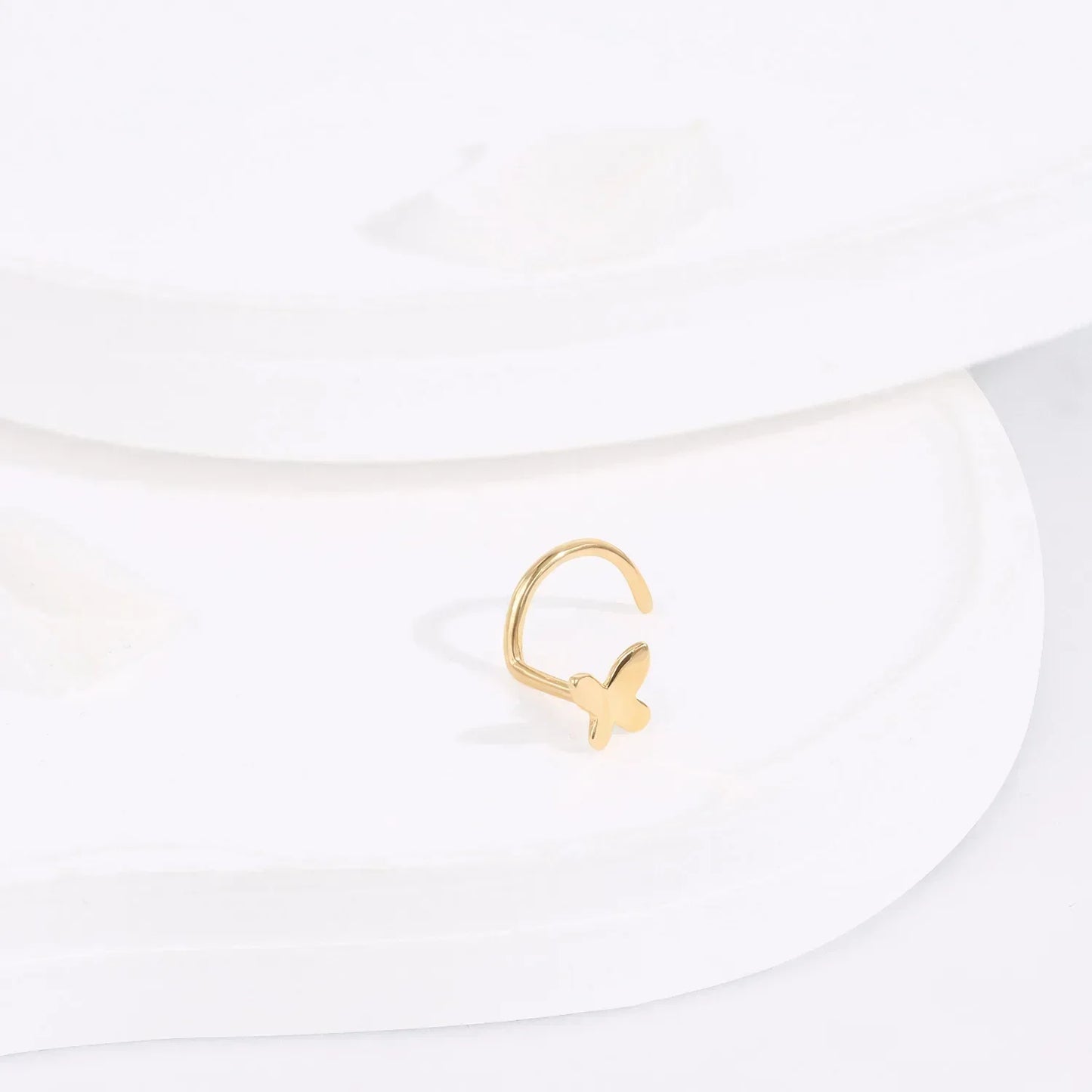 Minimalist gold butterfly adjustable ring on white display, Rosary Milano fashion jewelry