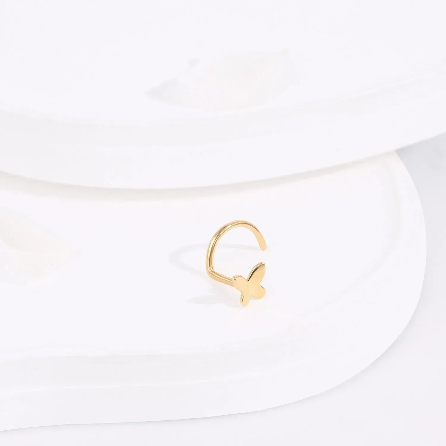 Minimalist gold butterfly adjustable ring on white display, Rosary Milano fashion jewelry
