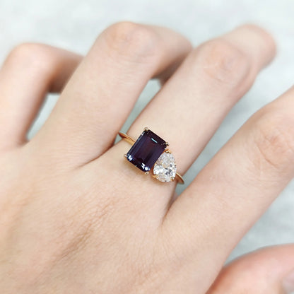 You and me ring with a color-changing alexandrite stone and a clear cz