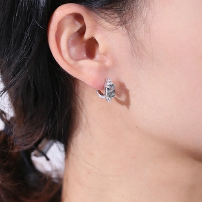 Silver and crystal fashion earring worn on woman's ear, Rosary Milano jewelry