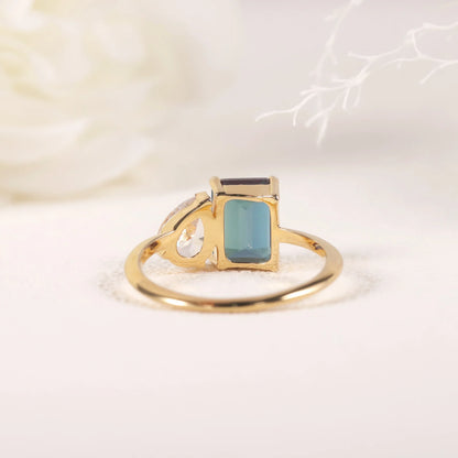 You and me ring with a color-changing alexandrite stone and a clear cz