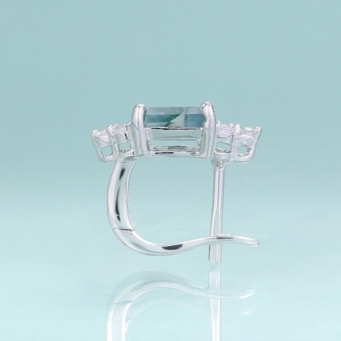 Silver earring with rectangular blue gemstone and clear accents from Rosary Milano jewelry