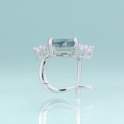 Silver earring with rectangular blue gemstone and clear accents from Rosary Milano jewelry