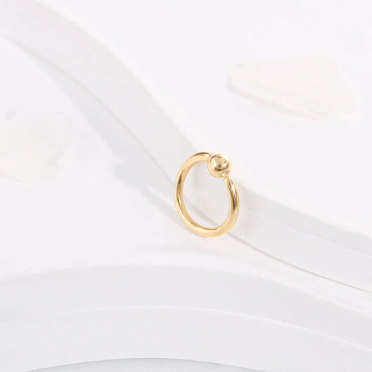 Minimalist gold hoop ring with bead accent on white background, Rosary Milano jewelry