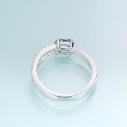 Moss agate wedding ring with a cross-shaped design in silver