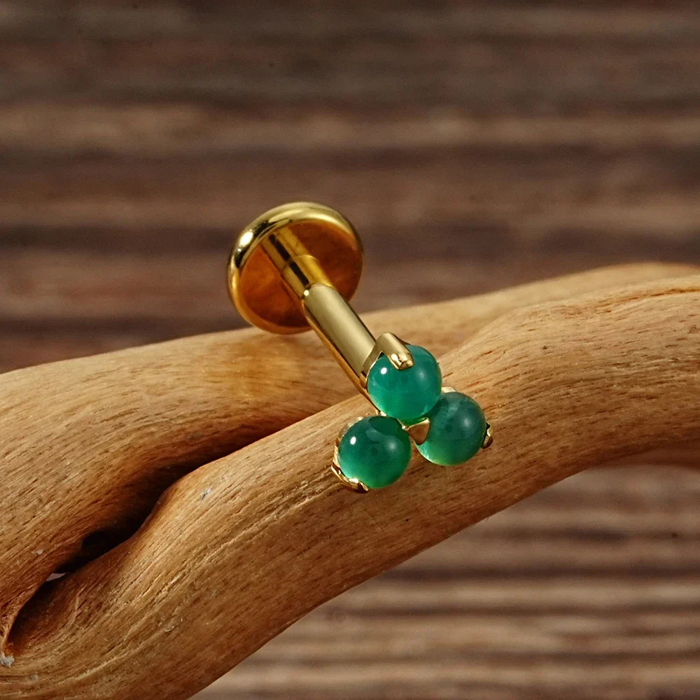 Cute Monroe piercing with natural gemstones red and green stones in silver and gold small Marilyn Monroe piercing titanium 16G