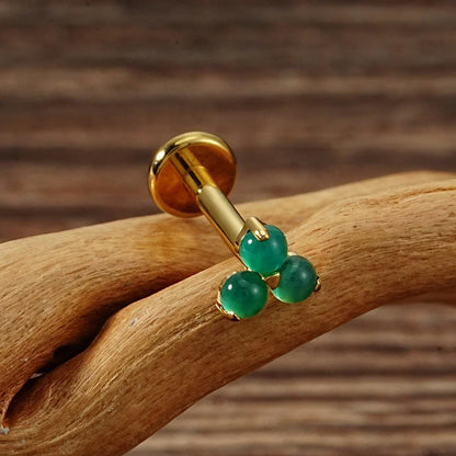 Cute Monroe piercing with natural gemstones red and green stones in silver and gold small Marilyn Monroe piercing titanium 16G