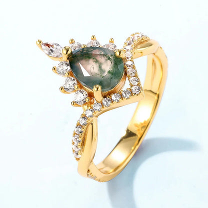 Moss agate wedding ring set with a pear-shaped moss agate sterling silver