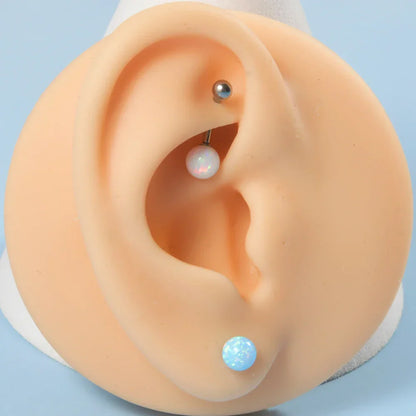 Barbell eyebrow piercing with opal titanium curved barbell