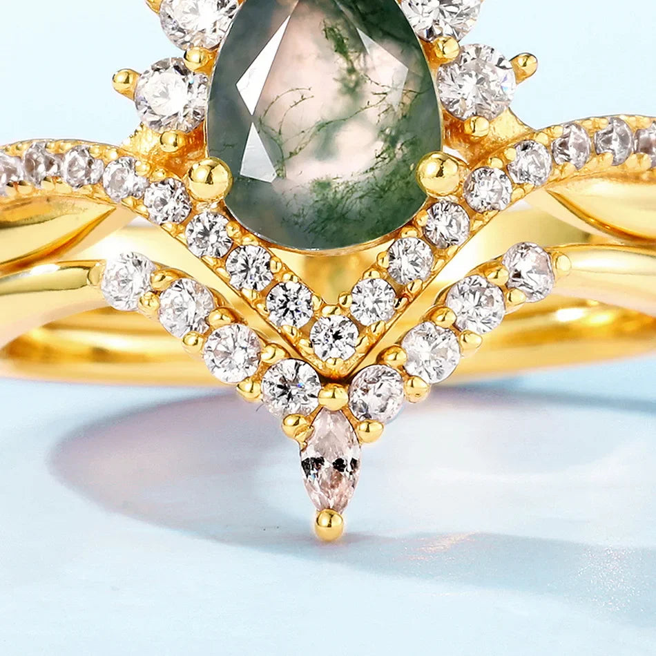 Moss agate wedding ring set with a pear-shaped moss agate sterling silver