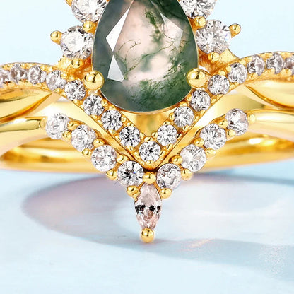 Moss agate wedding ring set with a pear-shaped moss agate sterling silver