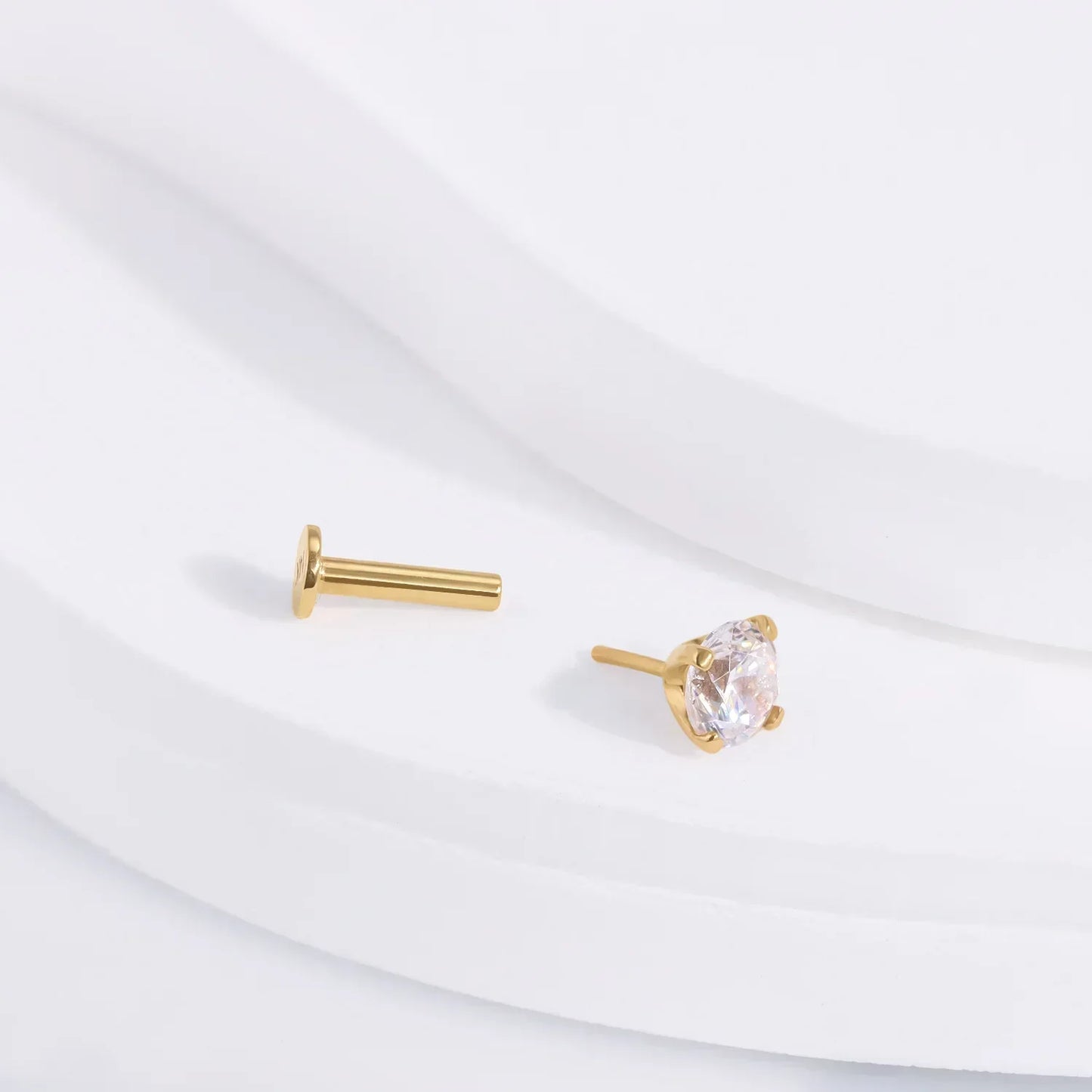 Gold stud earring with clear gemstone from Rosary Milano on white background