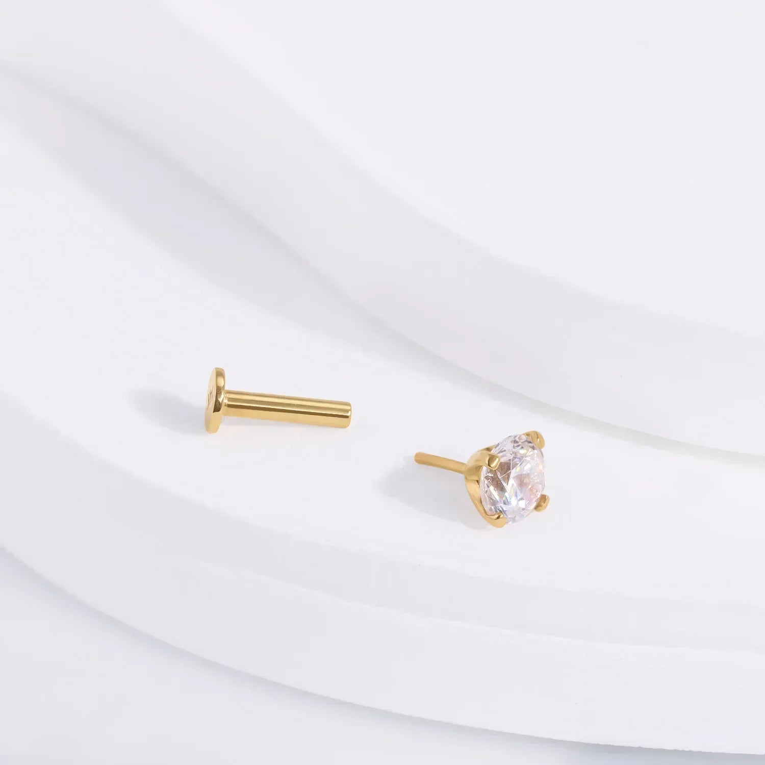 Gold stud earring with clear gemstone from Rosary Milano on white background