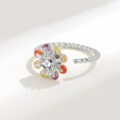 Silver anxiety ring with a colorful charm spinner ring