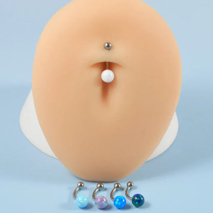 Barbell eyebrow piercing with opal titanium curved barbell