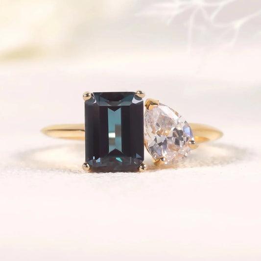 You and me ring with a color-changing alexandrite stone and a clear cz