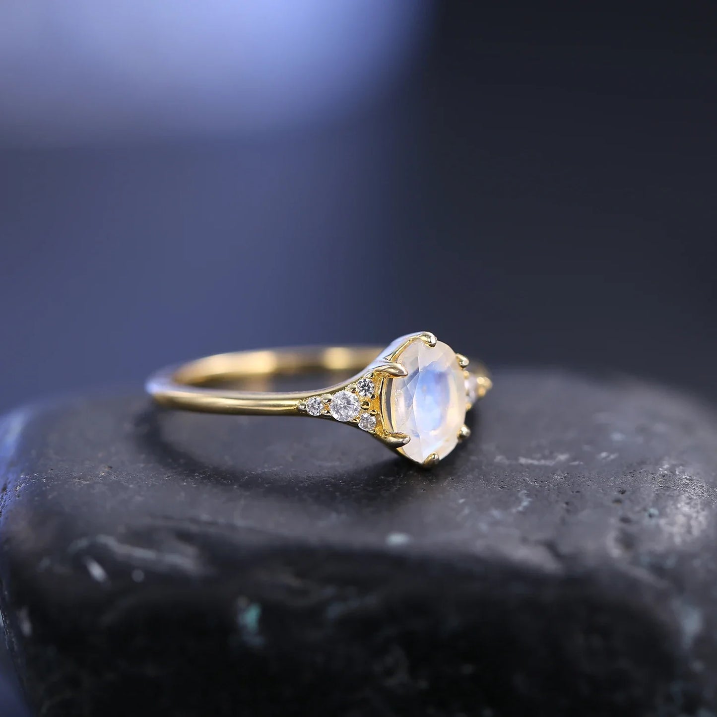 Moonstone and diamond engagement ring with an oval moonstone