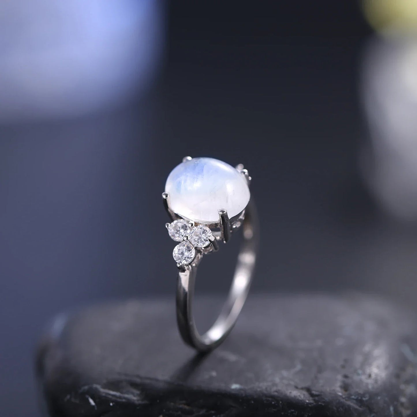 Silver moonstone ring with an oval moonstone and clear diamond cz