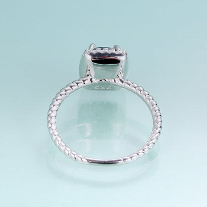Moss agate engagement ring in silver halo ring rectangle shaped
