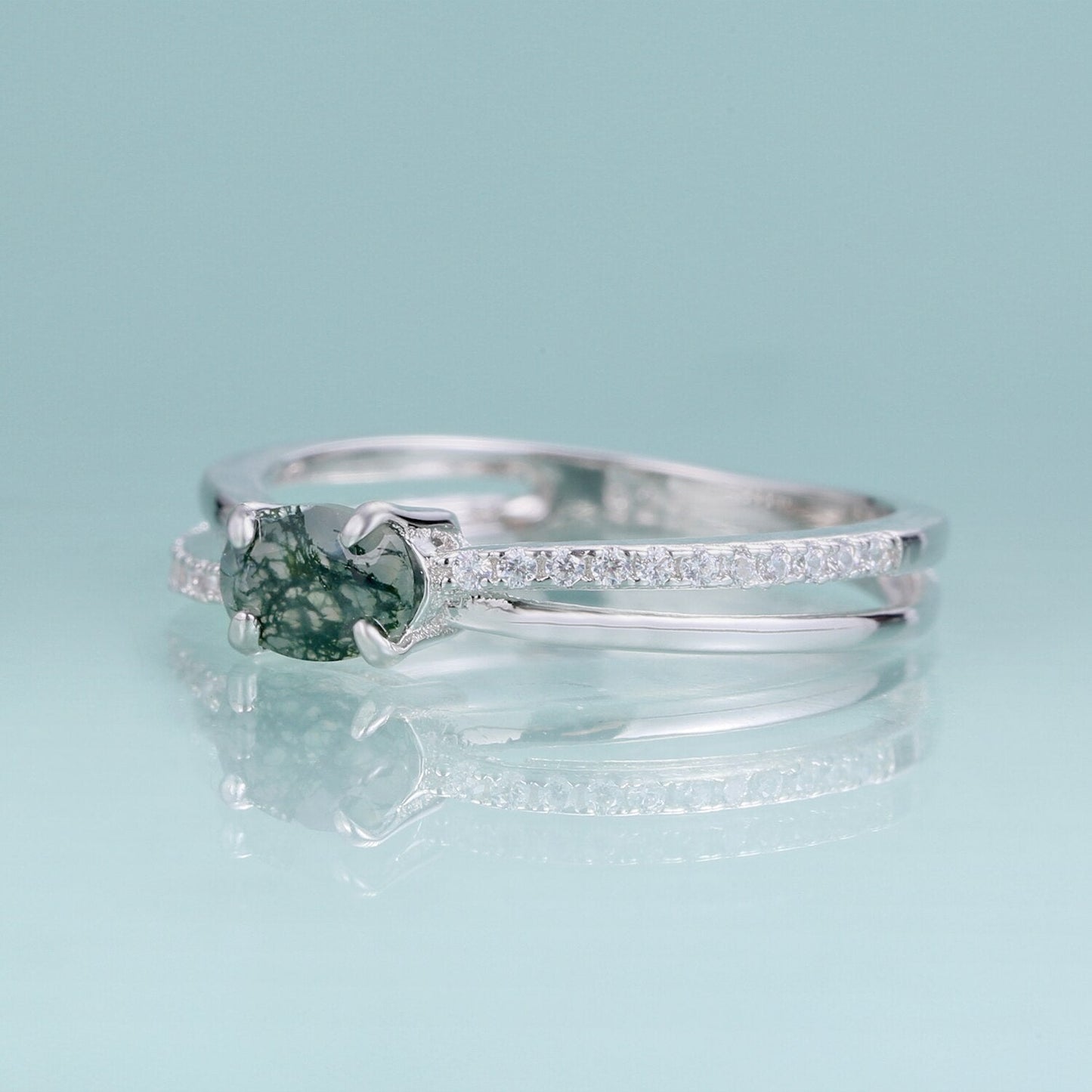Moss agate wedding ring with a cross-shaped design in silver
