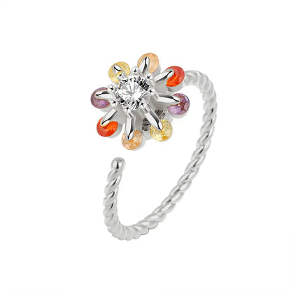 Silver anxiety ring with a colorful charm spinner ring